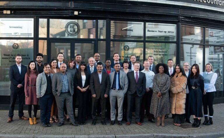 Team image of BC&A CHartered Accountants outside of their Southsea office on Elm Grove